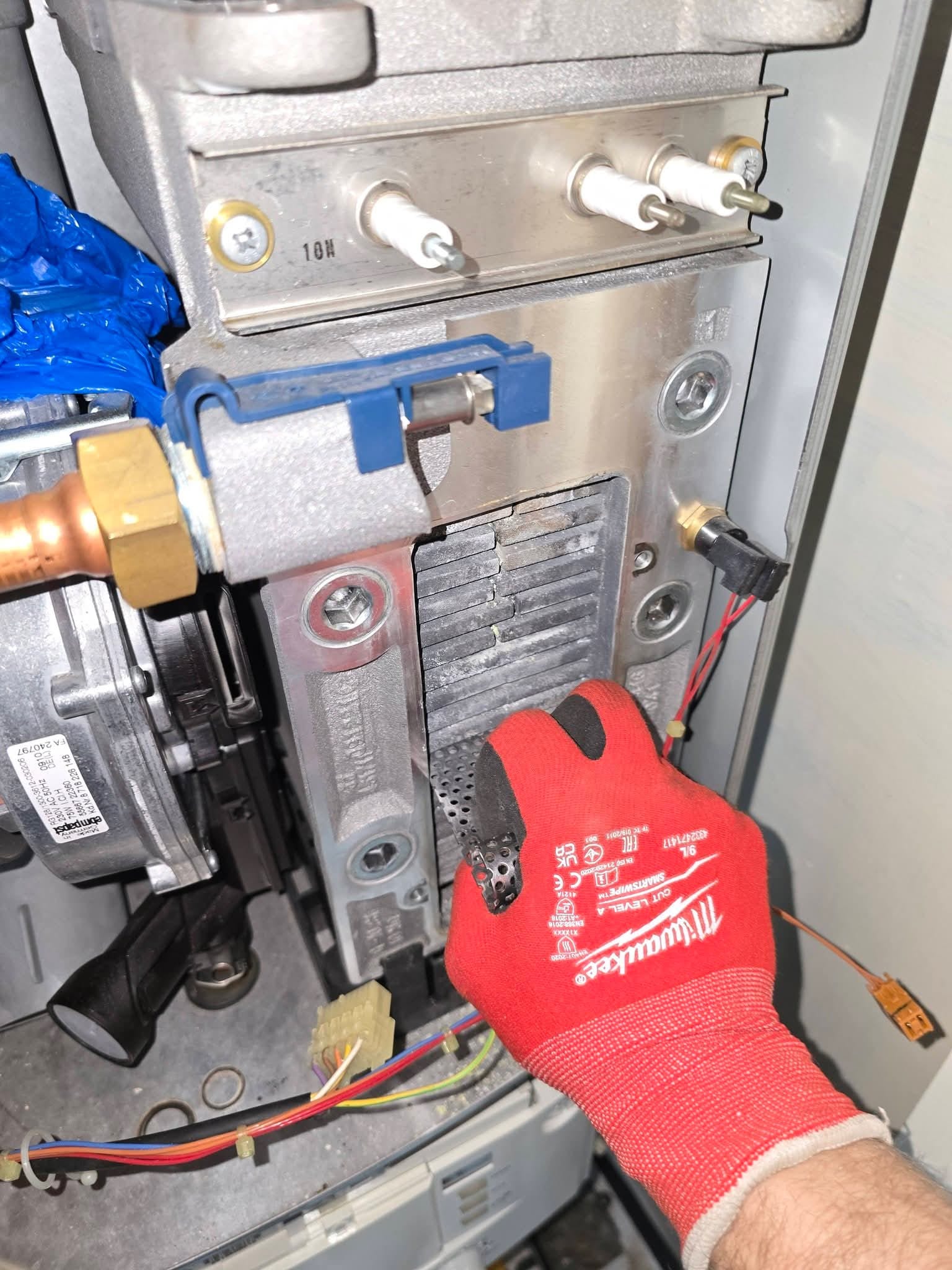 Engineer repairing a boiler